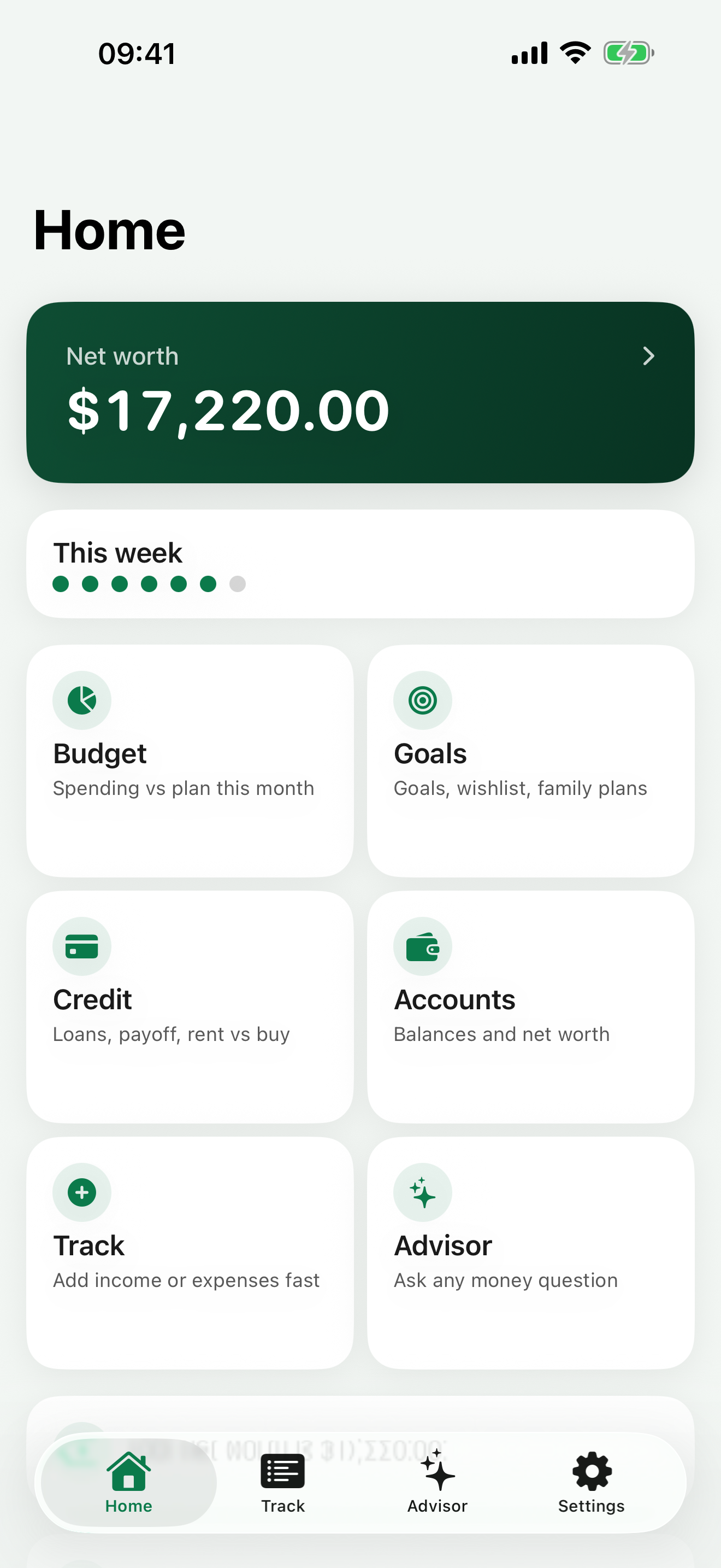 FinTraicker home hub on iPhone, showing net worth and quick actions for budget, goals, and credit tools.